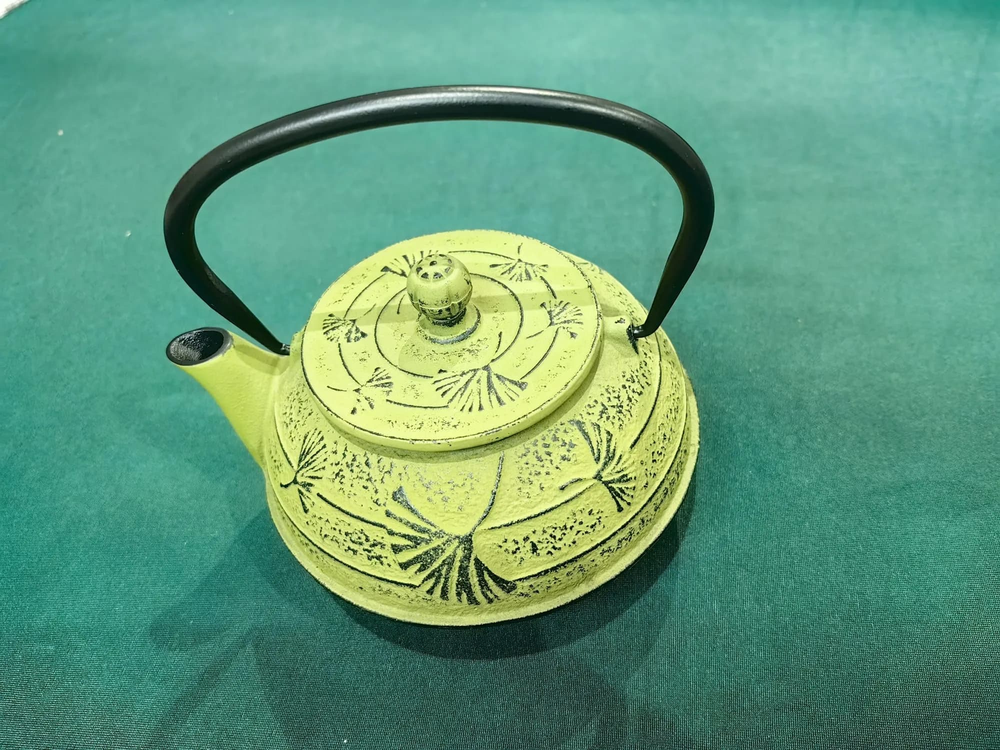 Olive green cast iron teapot with two cups — view 2